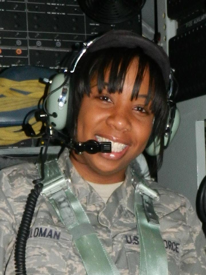 Rachel Alexander during her Air Force service, wearing a flight headset aboard a military aircraft